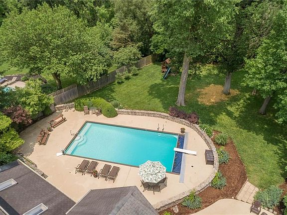 Aerial view for back yard....the lot extends beyond the trees and creek only about 50-60% is in front of fence in back the rest of the yard is beyond.