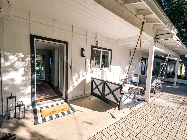 Enjoy the Arcadia Lite way of living with cozy outdoor seating on porch bed swings that seat 4