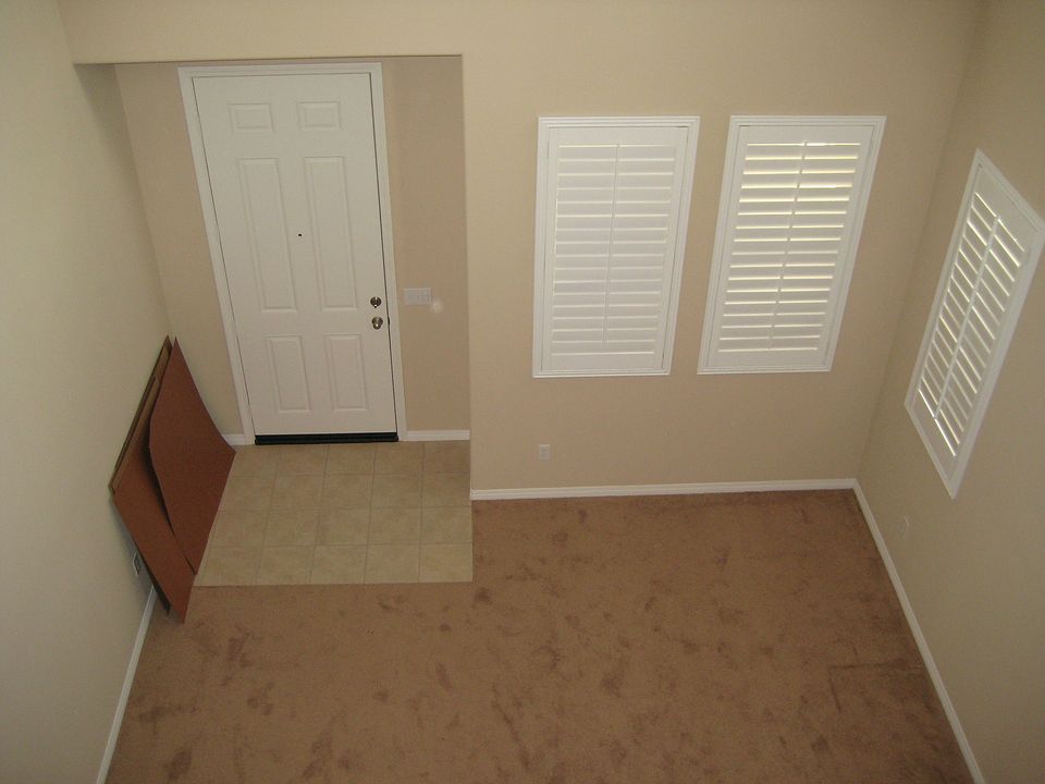 High celling entry with living room