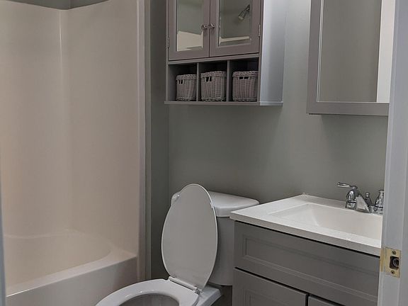 Bathroom with new vanities, sink, toilet.