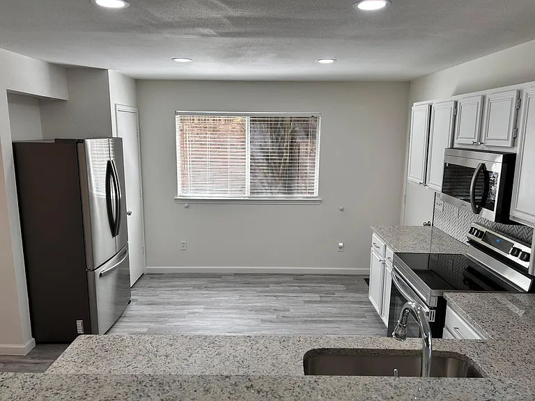 New refrigerator in spacious kitchen