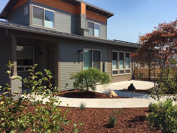 Large Glass doors lead to lovely Concrete Patio