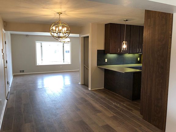Front room, garage entrance, kitchen and basement entrance