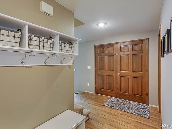 Enjoy lovely double doors and a hardwood entry