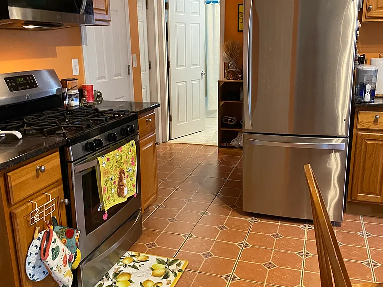 Storage closets on either side of stove.