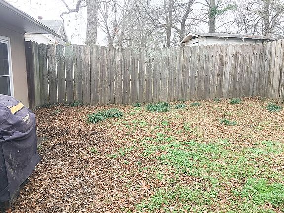 Partially fenced backyard 