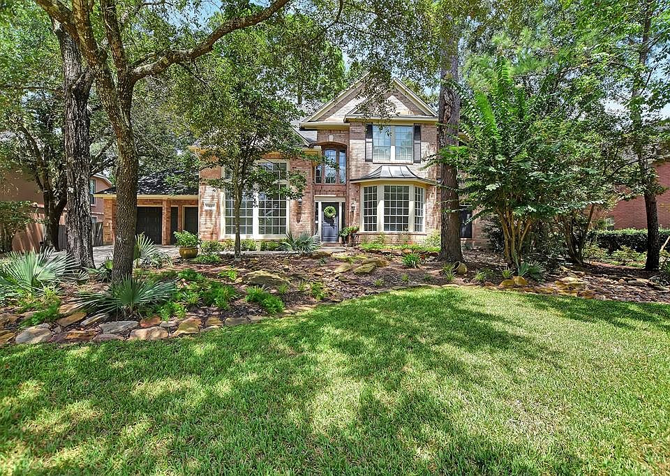 Welcome to this beautiful home in the heart of The Woodlands with its timeless exterior and lush landscaping!