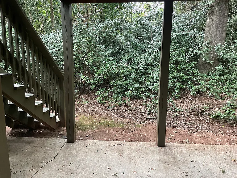 Your private patio opens into a sheltered greenspace for you to enjoy