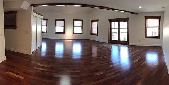 downstairs open concept living area. shown later in photo furnished.