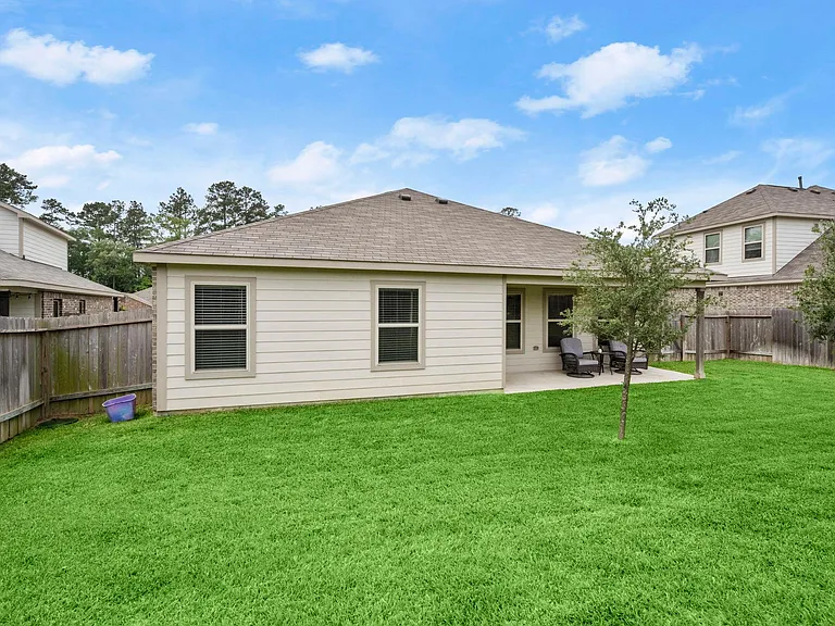 A GENTLY SLOPING BACKYARD PLAY AREA!