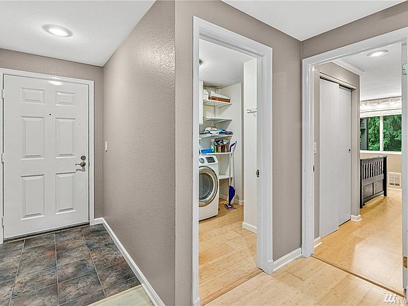 Laundry room on the right, second bedroom beyond.