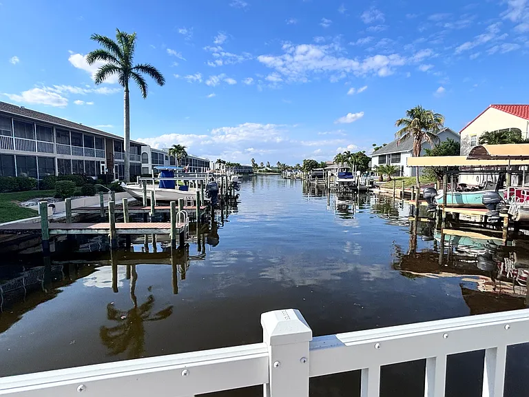 View of canal and boat docks from the pool. Enjoy!