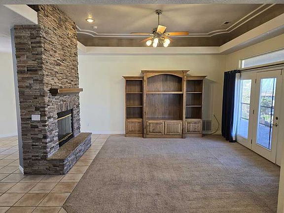 Spacious living area with built in book case.