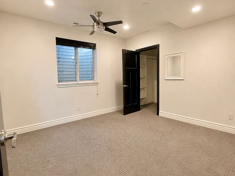 second bedroom with walk in closet