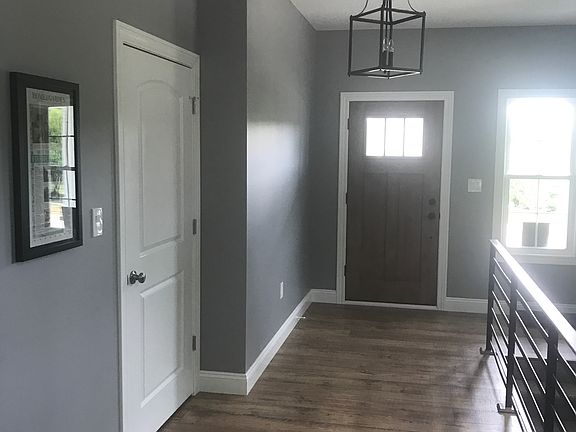 Entry area w custom railings