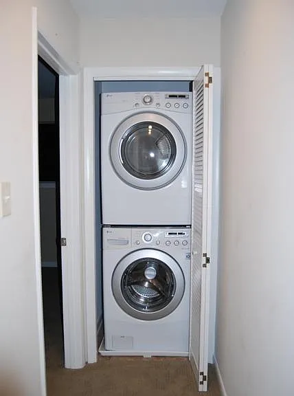 Full sized washer and dryer on second floor.