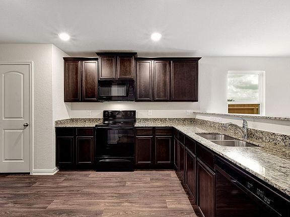 The kitchen comes with a full suite of energy-efficient appliances