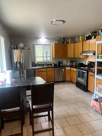 Large kitchen with eating area. - 10500 W 8th Pl