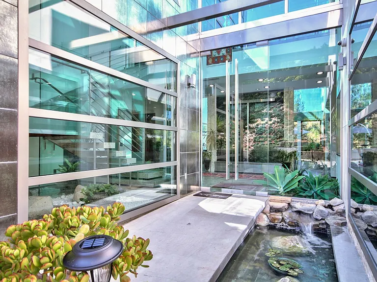 one of the front door entrance with flowing water feature