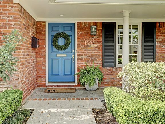 Welcome to this comfortable and gracious home! The front porch offers recessed lighting and shade. There is additional walkway access directly to the drive as well.