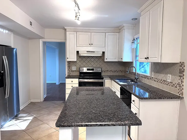 Laundry room with half bathroom