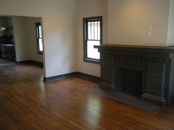 Formal living w/decrative fireplace and hardwoods