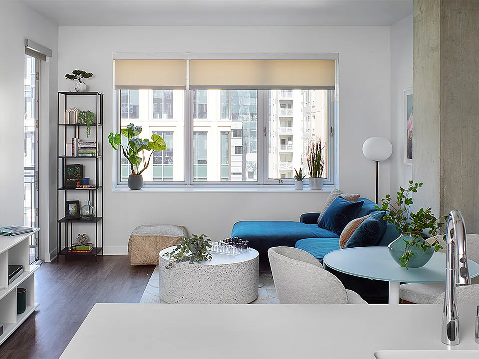 Apartment living room with wood-style flooring.