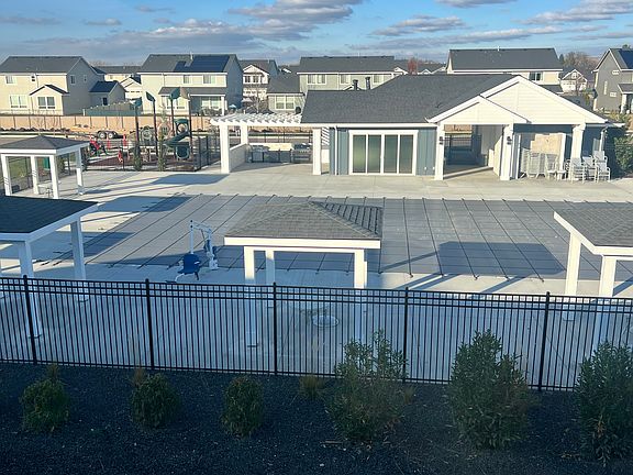 pool and clubhouse with grills and park