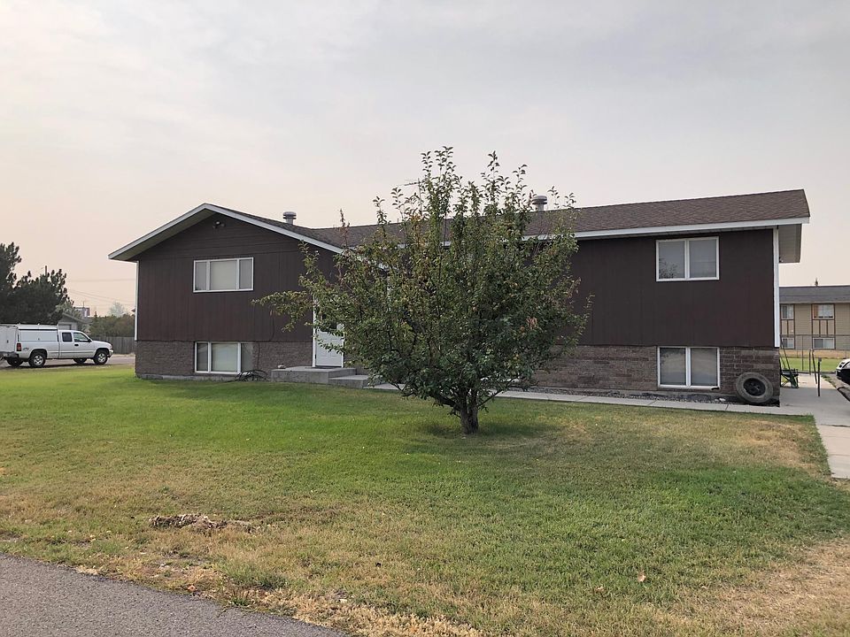 Exterior showing very edge of parking lot and off street parking.