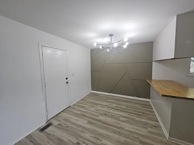 Dining Room, with kitchen bar - open access floorplan makes this 1000 sq ft home feel far larger than it's actual size.