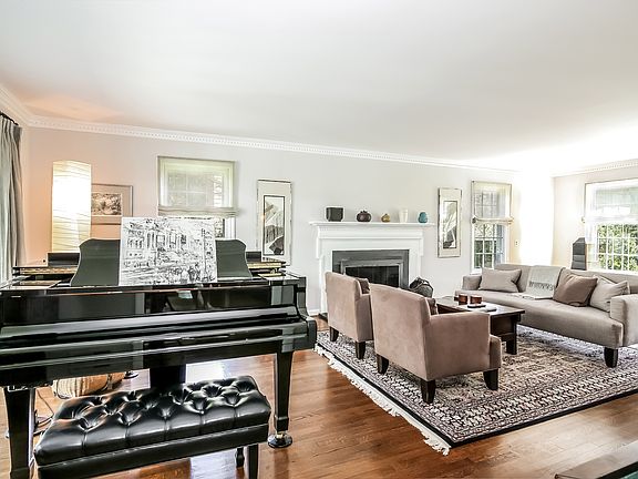 Tranquil living room with a wood burning fireplace.