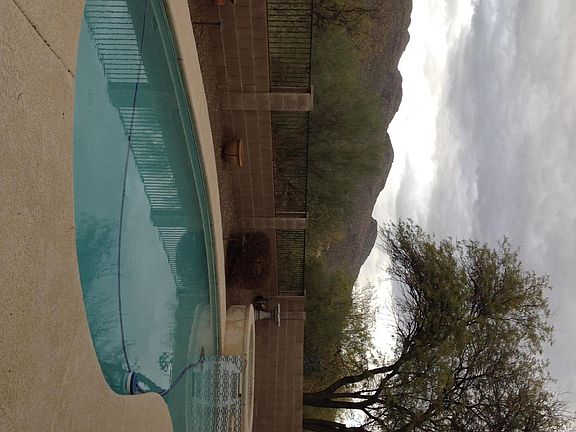 Surrounded by mountain views as you relax by pool/spa