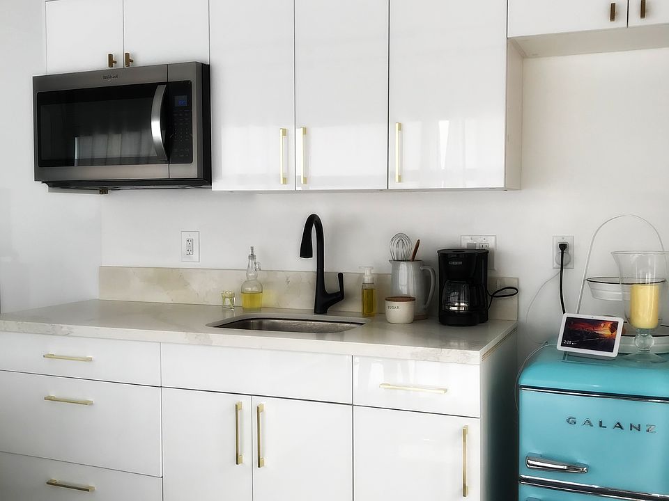 Beautiful kitchen cabinets w/quartz counter top; full size refrigerator will be provided (not pictured)