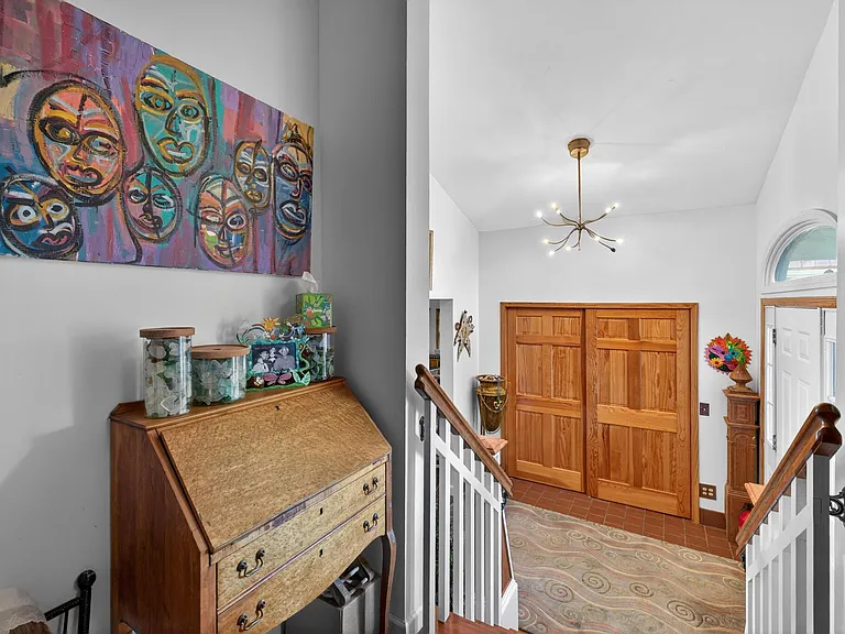 Up 4 stairs to the rest of the house.
