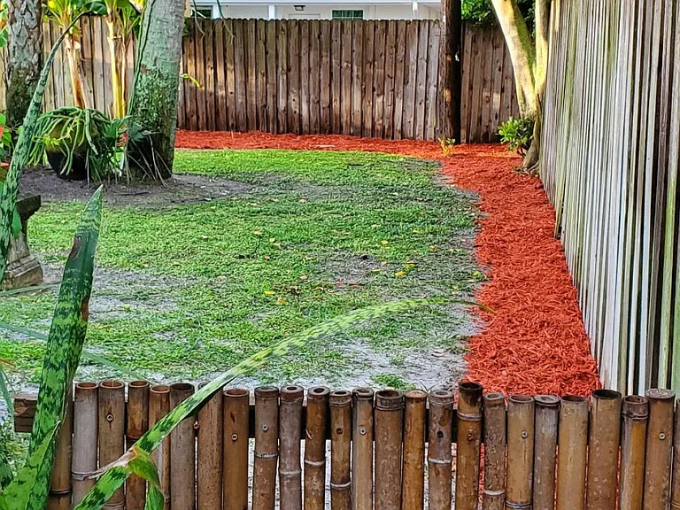West side of backyard; pictures to be updated. Small fence not there. Access to back yard for lawn maintenance