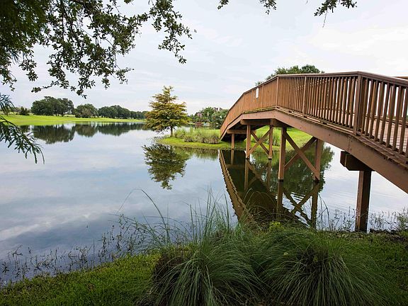 Bridge behind the community pool for a stroll around the lake.