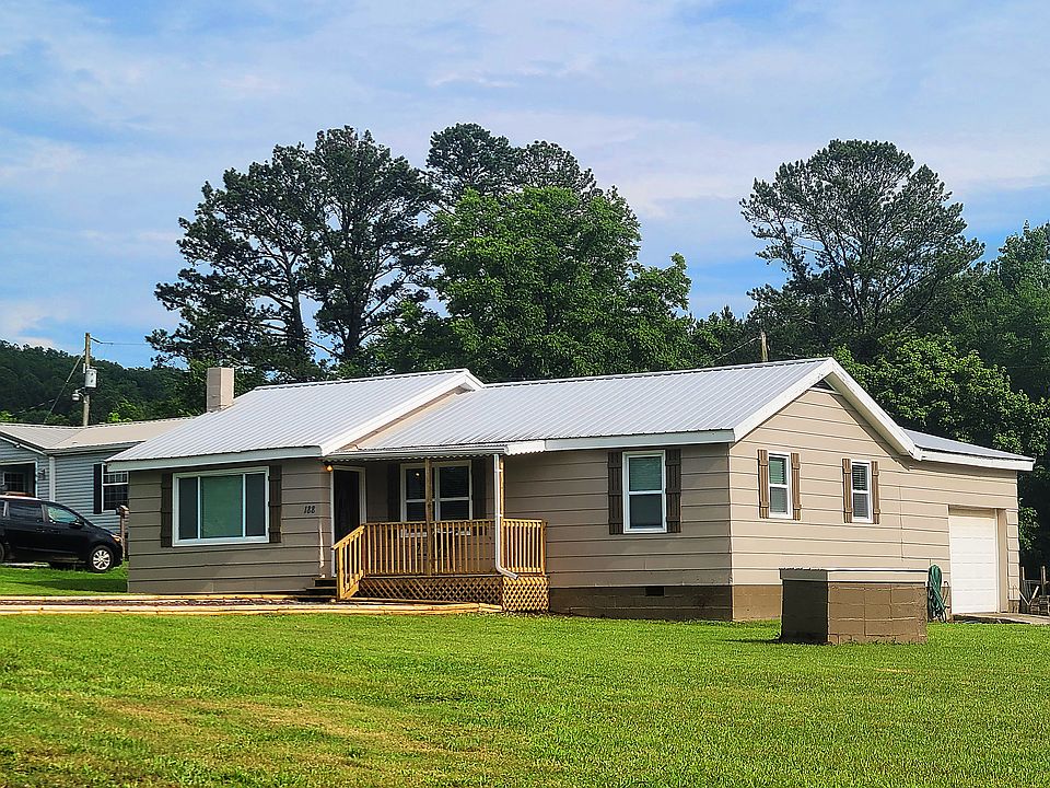 2 bdrm/2 bath house with garage and 2 gravel driveways.