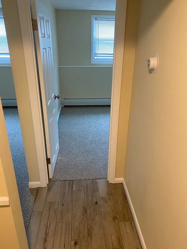Hall connecting kitchen, two bedrooms, and living Room