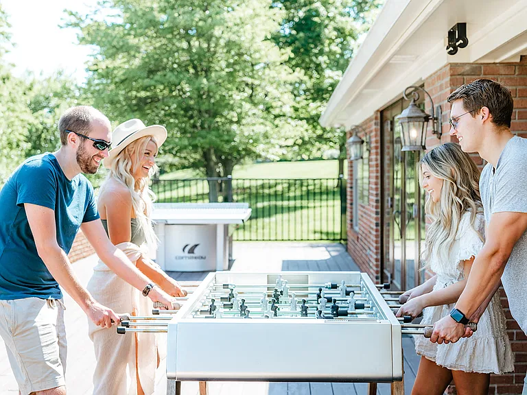 Outdoor foosball table and entertainment deck