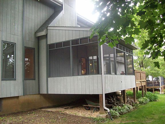 screened in porch with open porch attached