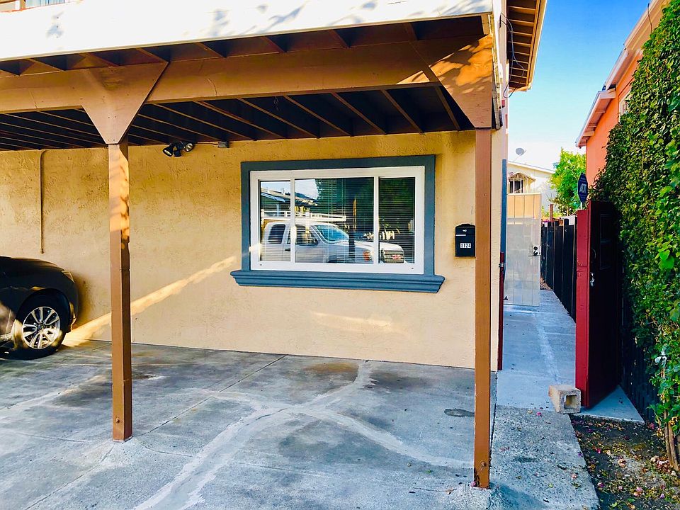 Covered Parking Spot and Gated Entrance to Unit