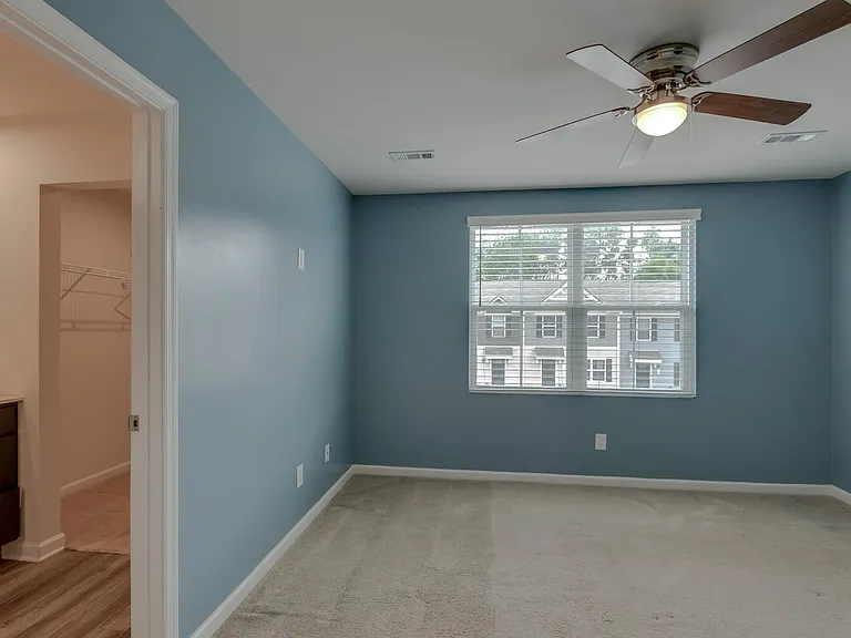 Master bedroom with attached bathroom and closet