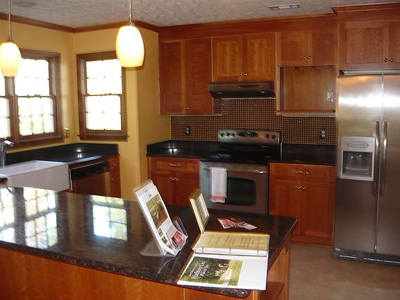 Kitchen with stainless steel appliances, huge fridge include