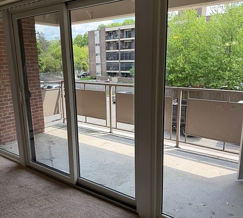 private balcony with sliding glass doors and storage outside
