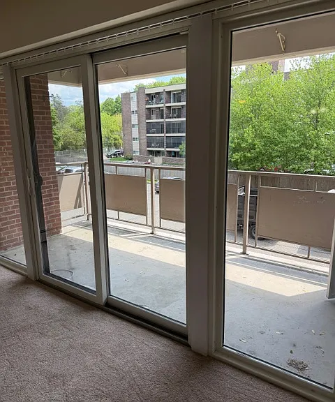 private balcony with sliding glass doors and storage outside