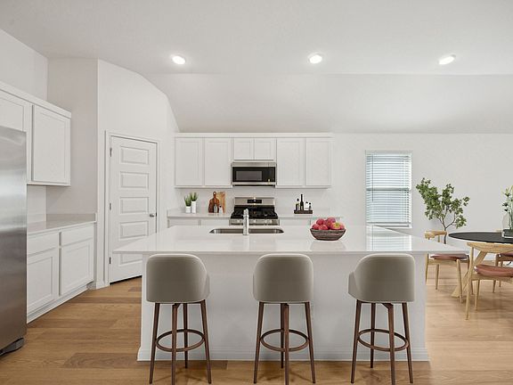 Kitchen in the Redbud home plan by Trophy Signature Homes - REPRESENTATIVE PHOTO