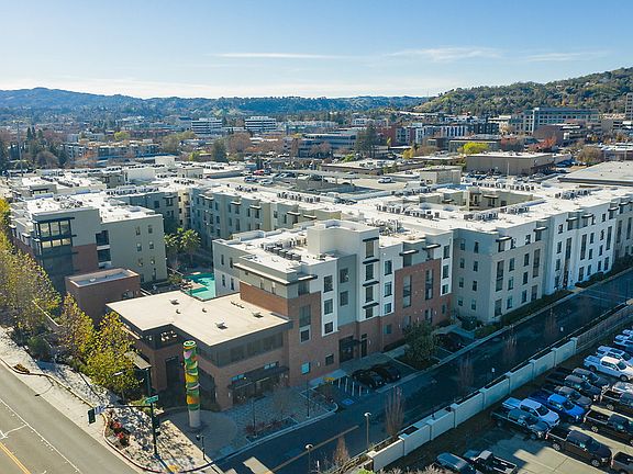 Aerial view of building exterior and views.