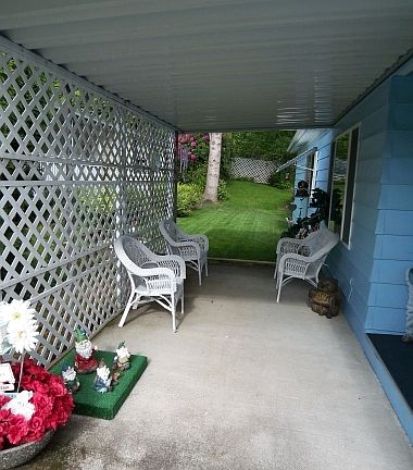 A pleasant patio at the entry is a perfect place to share a cup of coffee.