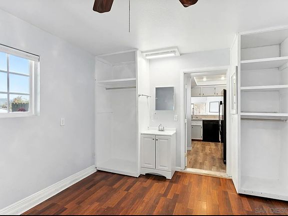 Facing the door, leads to kitchen and entryway