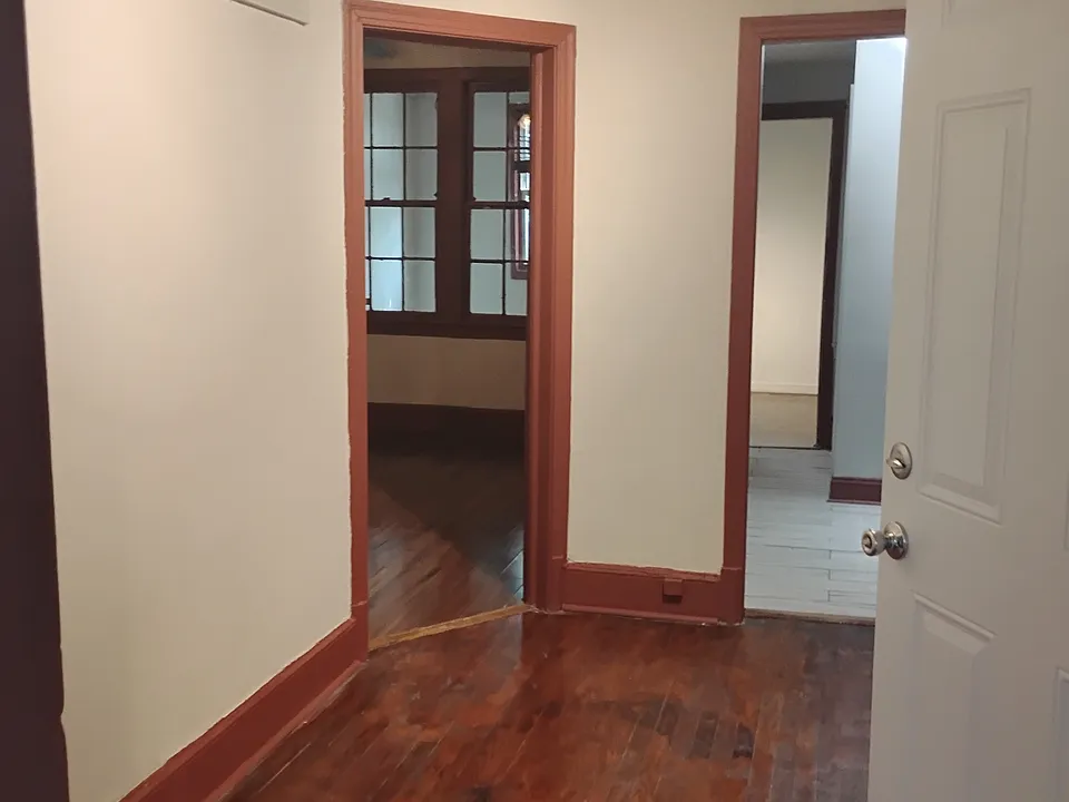 Entry from hallway with access to 2 bedrooms, bathroom, kitchen